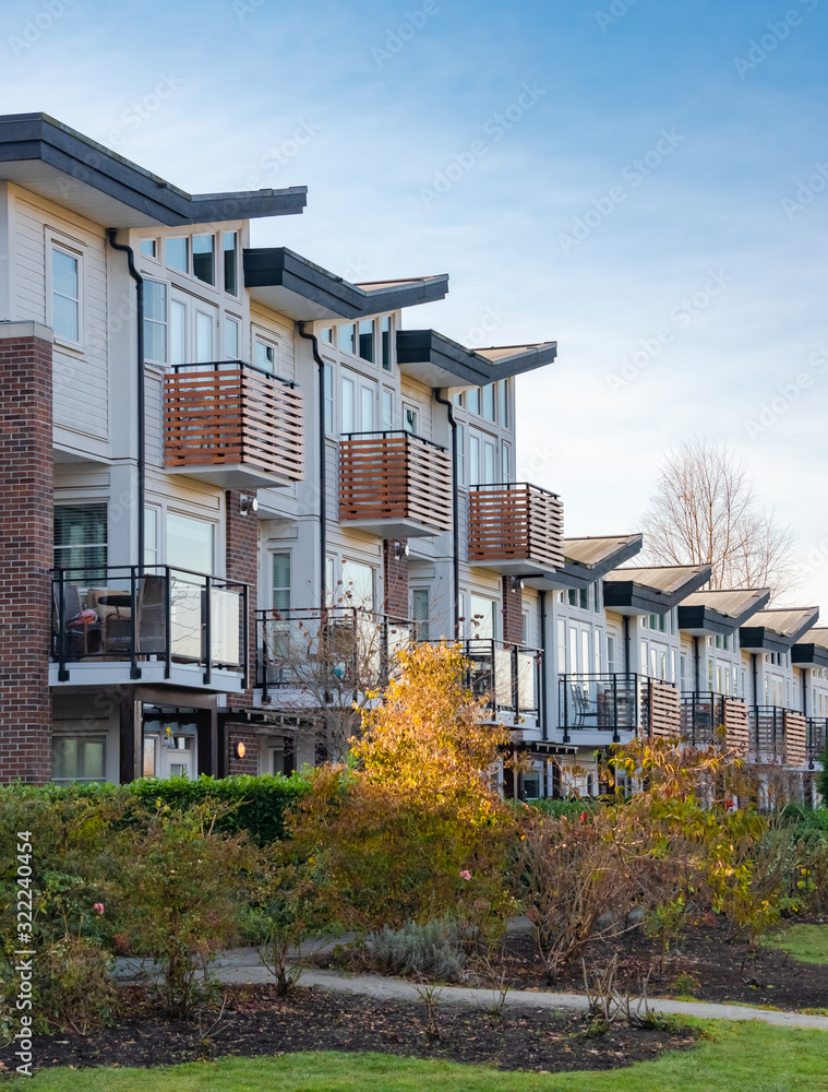 Fototapeta premium Row of residential townhouses on winter day in British Columbia.