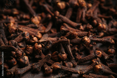 Dry cloves spices on the dark rustic background. Selective focus. shallow depth of field.