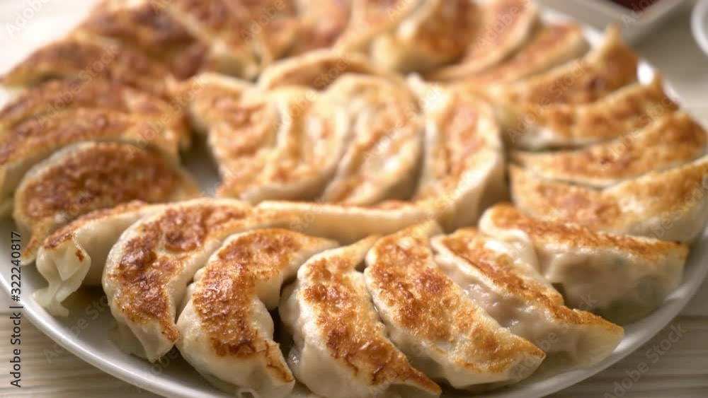 fried gyoza or dumplings snack with soy sauce in Japanese style fried gyoza or dumplings snack with soy sauce in Japanese style