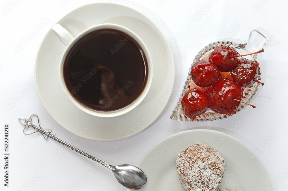 cup with spoon, apple jam in a bowl. white background. cup with spoon, apple jam in a bowl. white background.