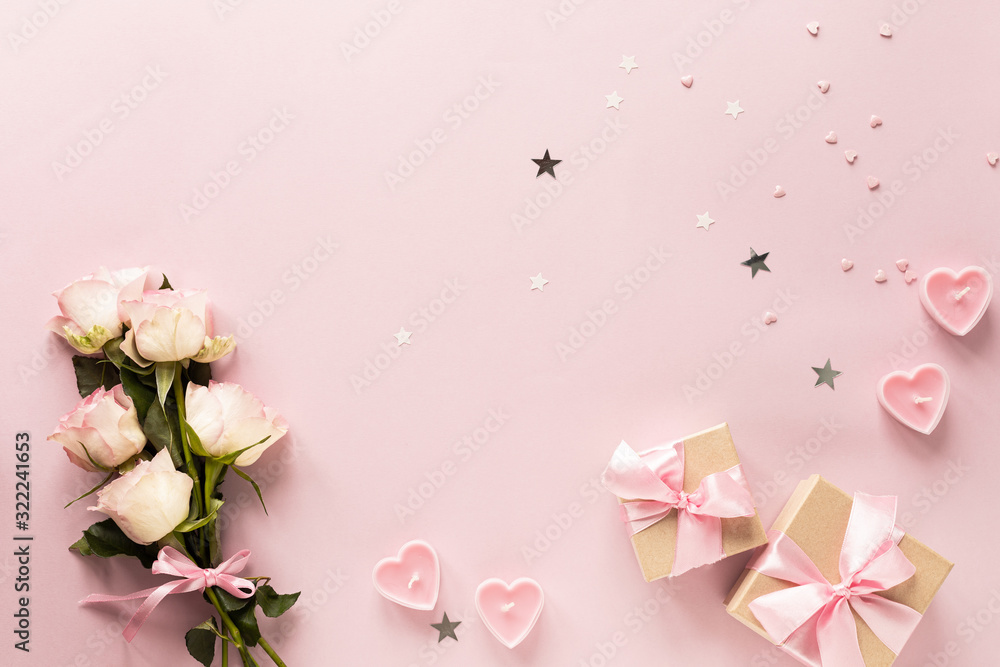 Gift box or gift box and flowers on pink table top view. Flat lay. Birthday, wedding, valentines day, march 8th concept. copy space Gift box or gift box and flowers on pink table top view. Flat lay. Birthday, wedding, valentines day, march 8th concept. copy space