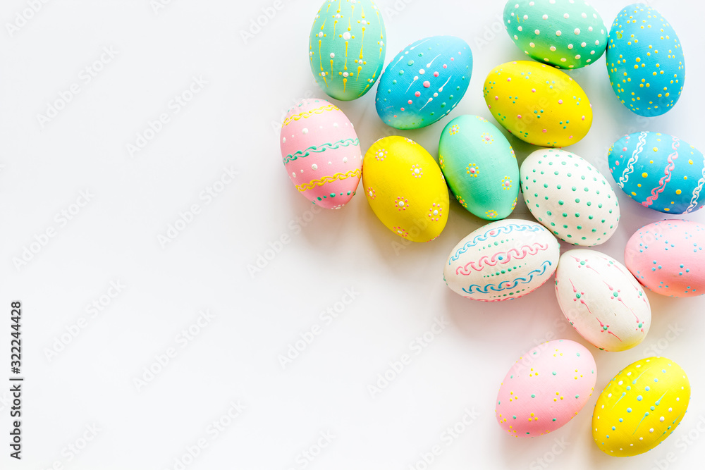 Easter eggs painted in pastel colors on white background top-down copy space Easter eggs painted in pastel colors on white background top-down copy space