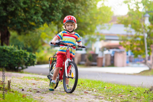 Fototapeta Naklejka Na Ścianę i Meble -  Kids on bike. Child on bicycle. Kid cycling.