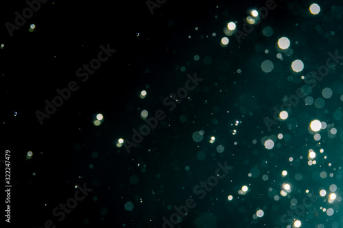 Abstract blur glitter bokeh on black