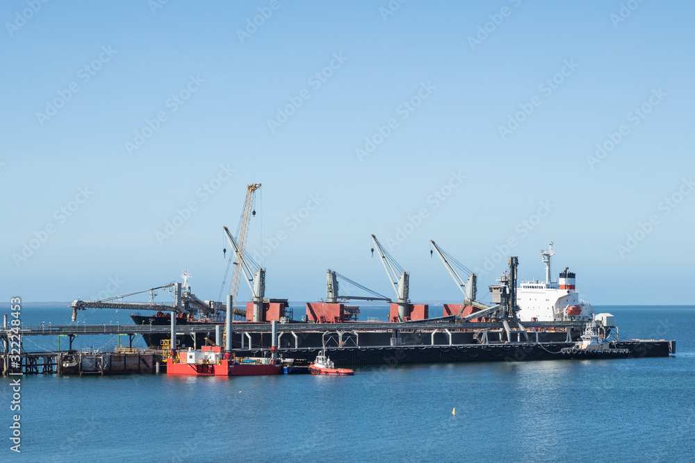 Container ship docked at the jetty port in Thevenard, South Australia