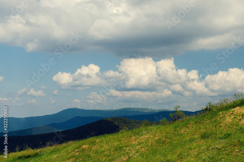 Beautiful landscape with mountain and propeller farm on the top Selective focus