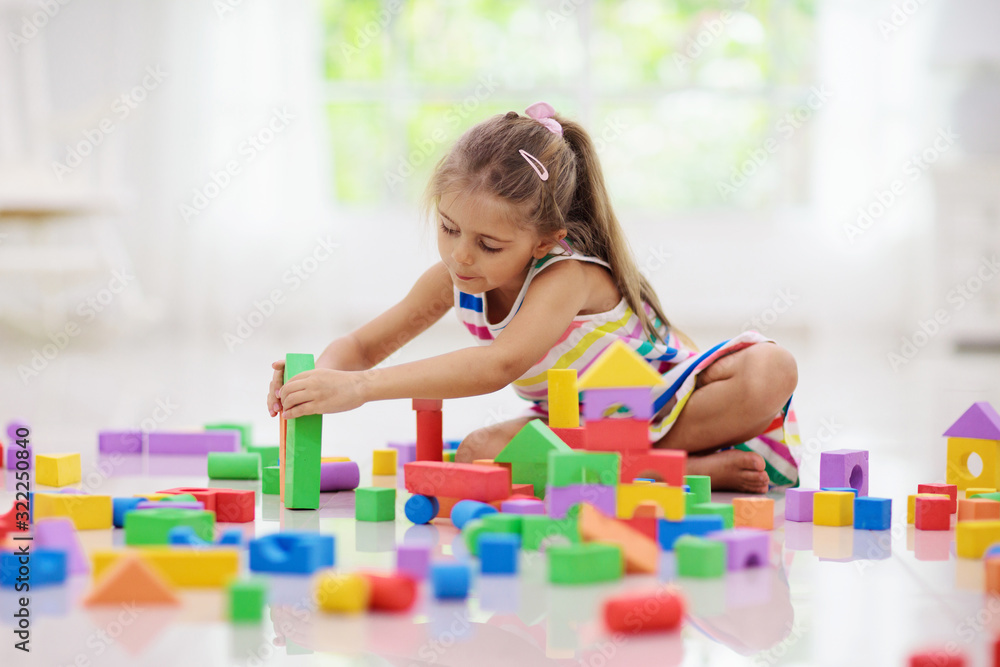 Child playing with toy blocks. Toys for kids. Child playing with toy blocks. Toys for kids.