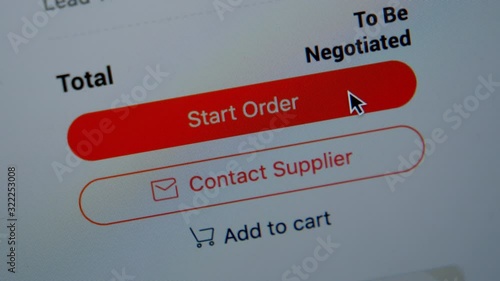 Online shopping. Close up of mouse clicking on Start Order button on Screen