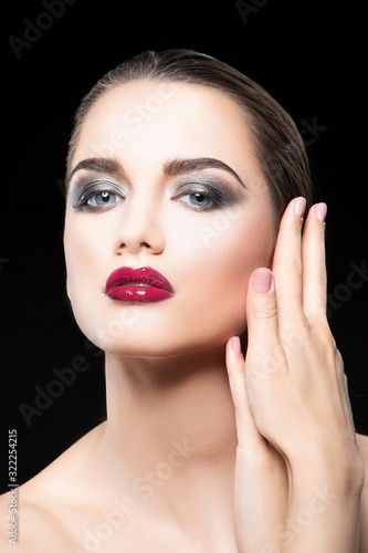 beauty face  of young woman isolated on black  healthy perfect skin  bright makeup. Skincare facial treatment concept