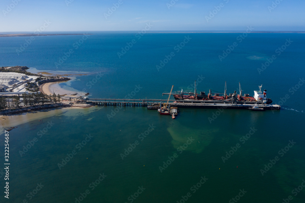 Aerial view of a container ship docked at the jetty in the port of Thevenard, South Australia