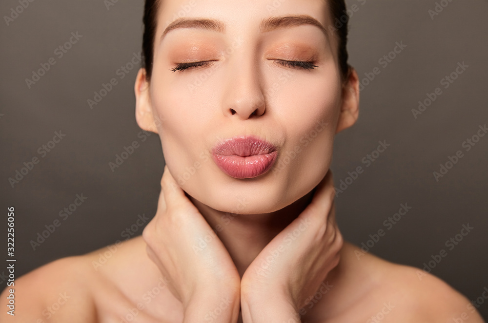 A romantic white lady makes a lip kiss. A romantic white lady makes a lip kiss.