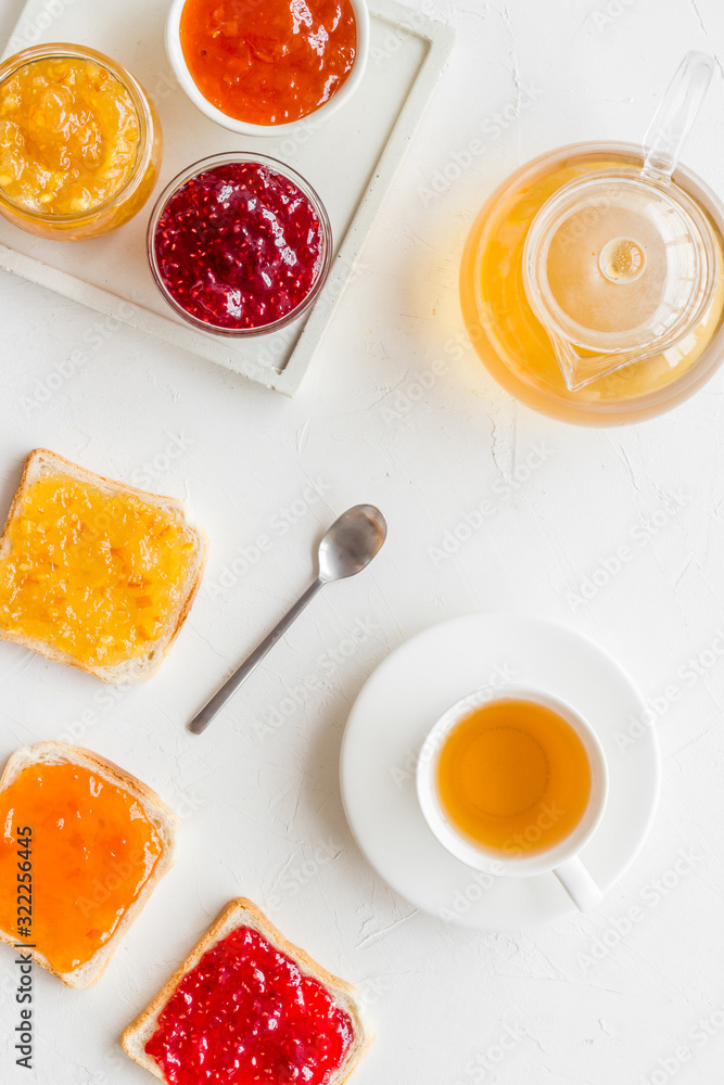 Tea party with jam. Toast, teapot, cup on white background