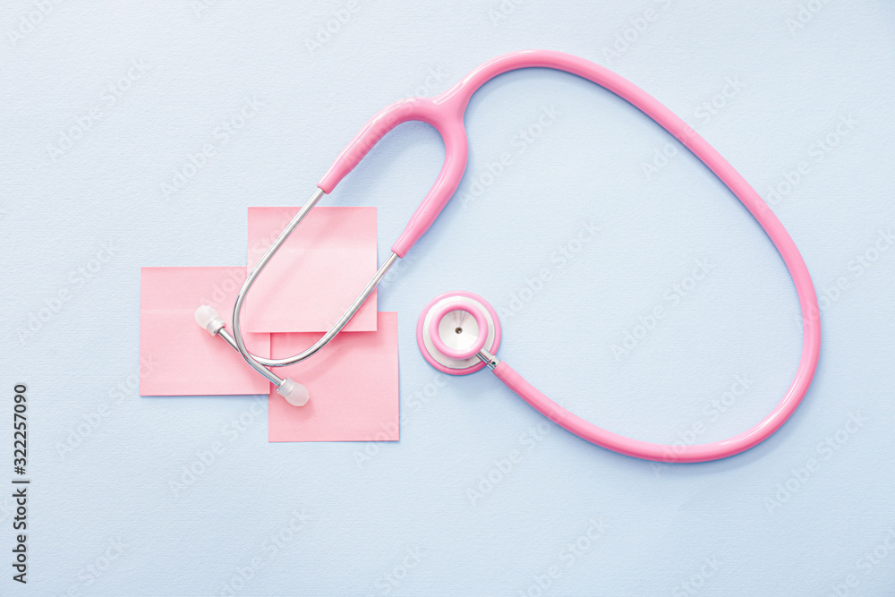 Stethoscope with paper sheets on white background. Cardiology concept Stethoscope with paper sheets on white background. Cardiology concept