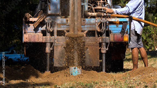 ground drilling water machine on old truck drilling in the ground for water