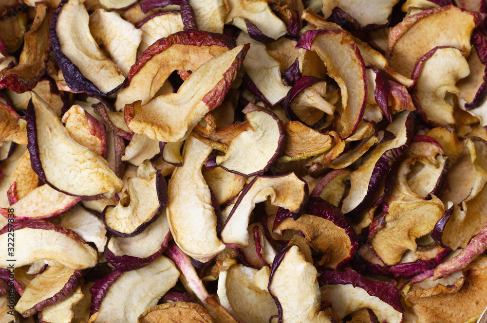 Dried Apple chips close-up. Natural background of chips. Organic natural food. Top view. Flat lay. Dried Apple chips close-up. Natural background of chips. Organic natural food. Top view. Flat lay.
