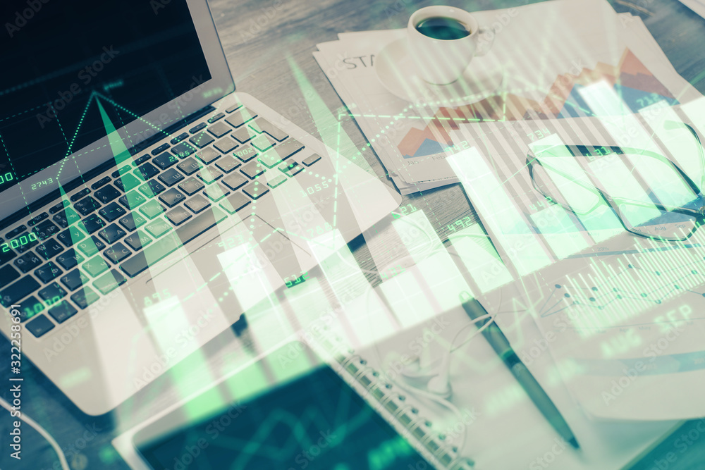 Stock market graph on background with desk and personal computer. Multi exposure. Concept of financial analysis. Stock market graph on background with desk and personal computer. Multi exposure. Concept of financial analysis.