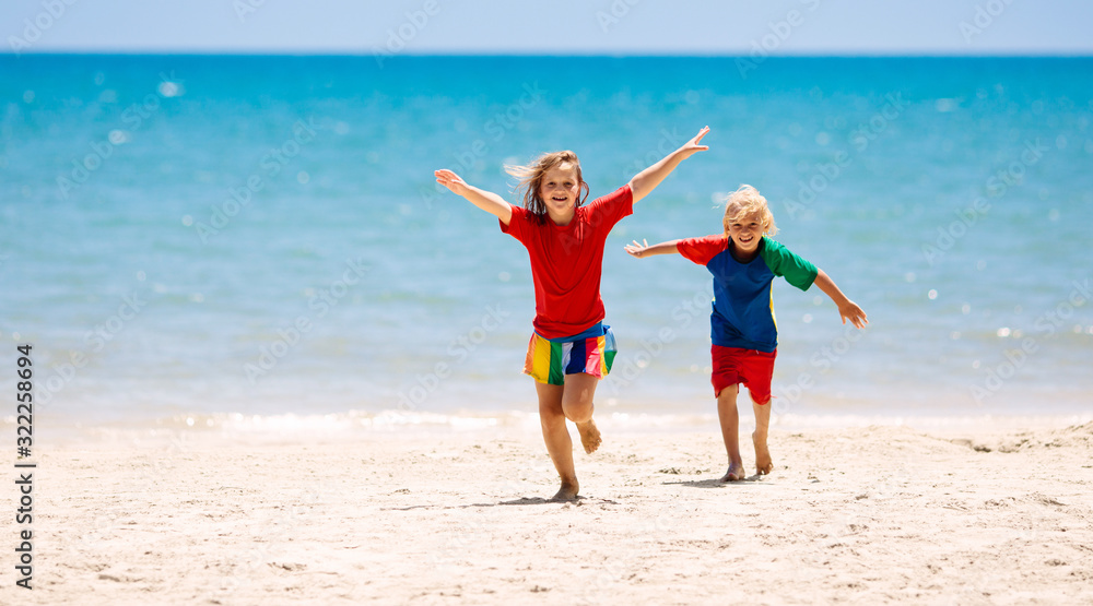 Kids playing on beach. Children play at sea. Kids playing on beach. Children play at sea.