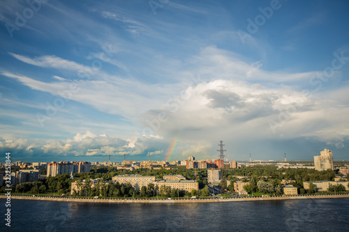 View of the distant city and the rainbow above it