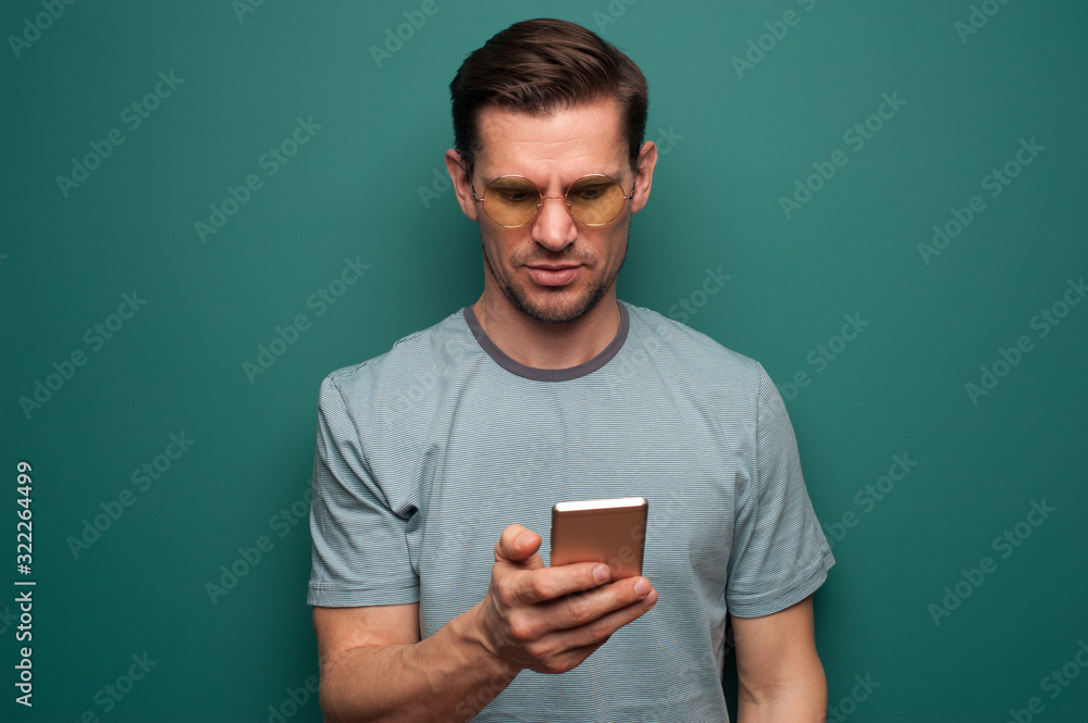 Portrait of a young man with smartphone Portrait of a young man with smartphone