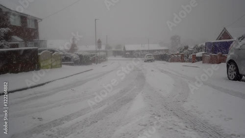 A sudden snow blizzard hits the pottery town of Stoke on Trent, heavy snow fall in a short period with no warning causing dangerous driving and walking conditions, heavy snowfall in the West Midlands photo