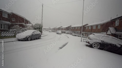 A sudden snow blizzard hits the pottery town of Stoke on Trent, heavy snow fall in a short period with no warning causing dangerous driving and walking conditions, heavy snowfall in the West Midlands photo