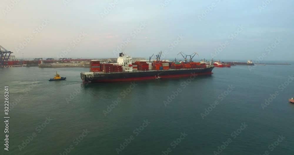 Drone shot of a big ship leaving a port Drone shot of a big ship leaving a port