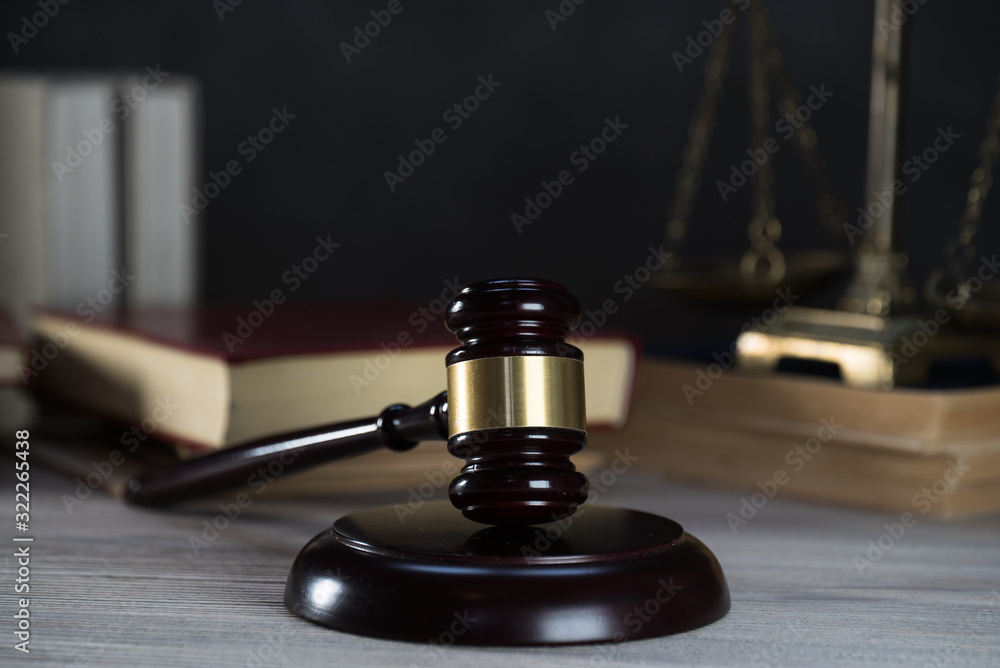 Law and Justice symbols over black background Law and Justice symbols over black background