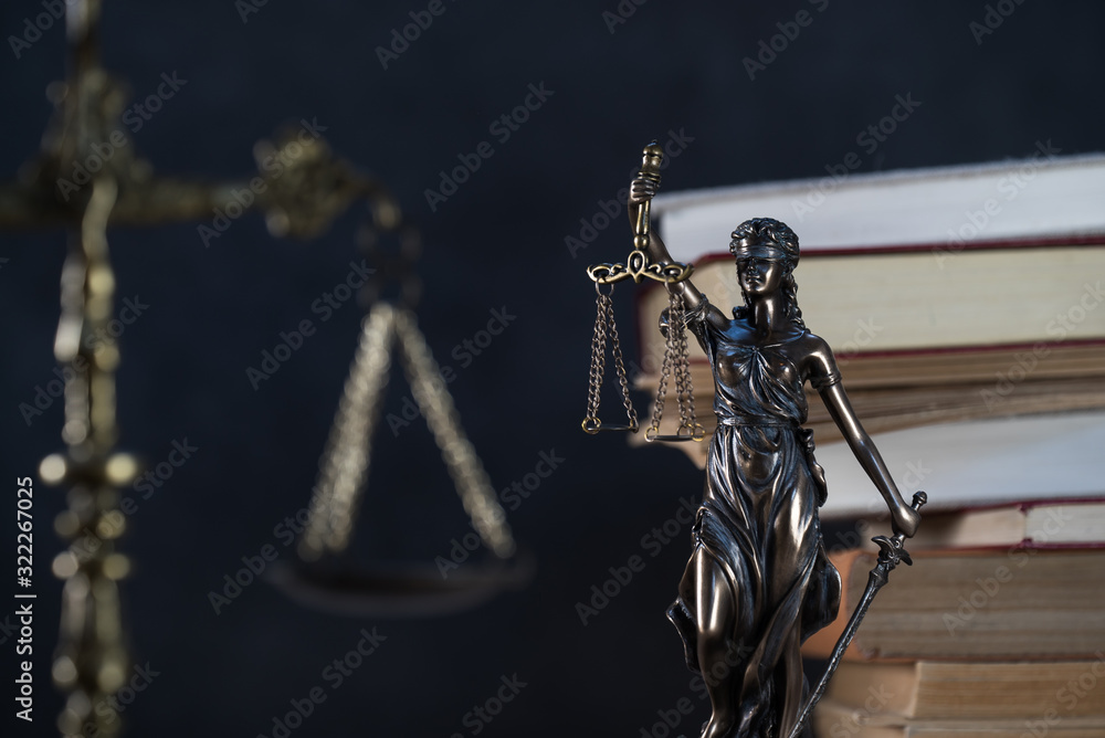 Law and Justice symbols over black background Law and Justice symbols over black background