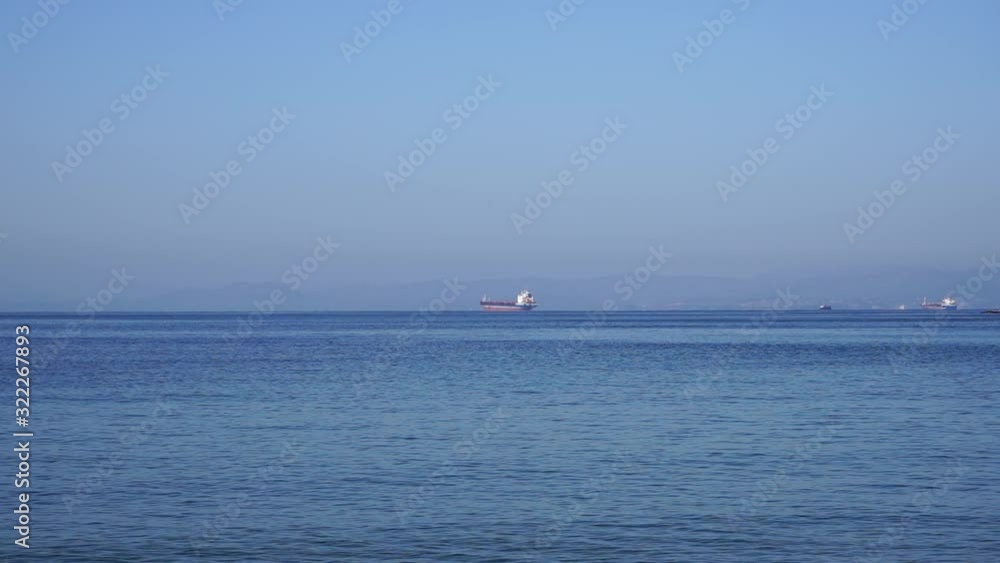 Seascape with a view of ships on the horizon Seascape with a view of ships on the horizon