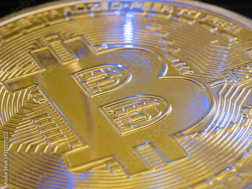 Bitcoin macro close up stock photo. Crypto commerce concept. Web trading bitcoin. Gold mining coin.