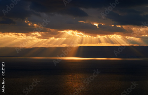 Beautiful sunset at Dead Sea, Jordan. Rays of lights