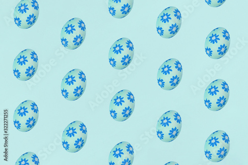 Blue Easter eggs on a blue background. Festive preparation, pattern, repetition, banner.