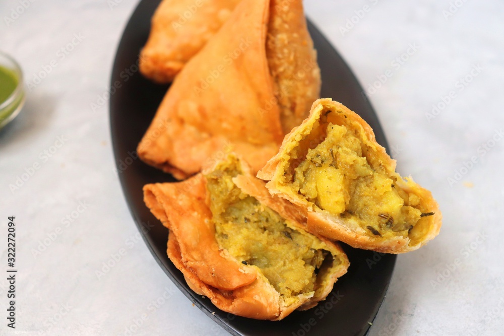 Vegetarian Aloo Samosa Or Samosas Indian Special Traditional Street Food  Famous Indian Punjabi Samosa Filled With Spicy Boiled Potato Mixture Served  With Green And Red Chutneys Copy Space Stock Photo - Download