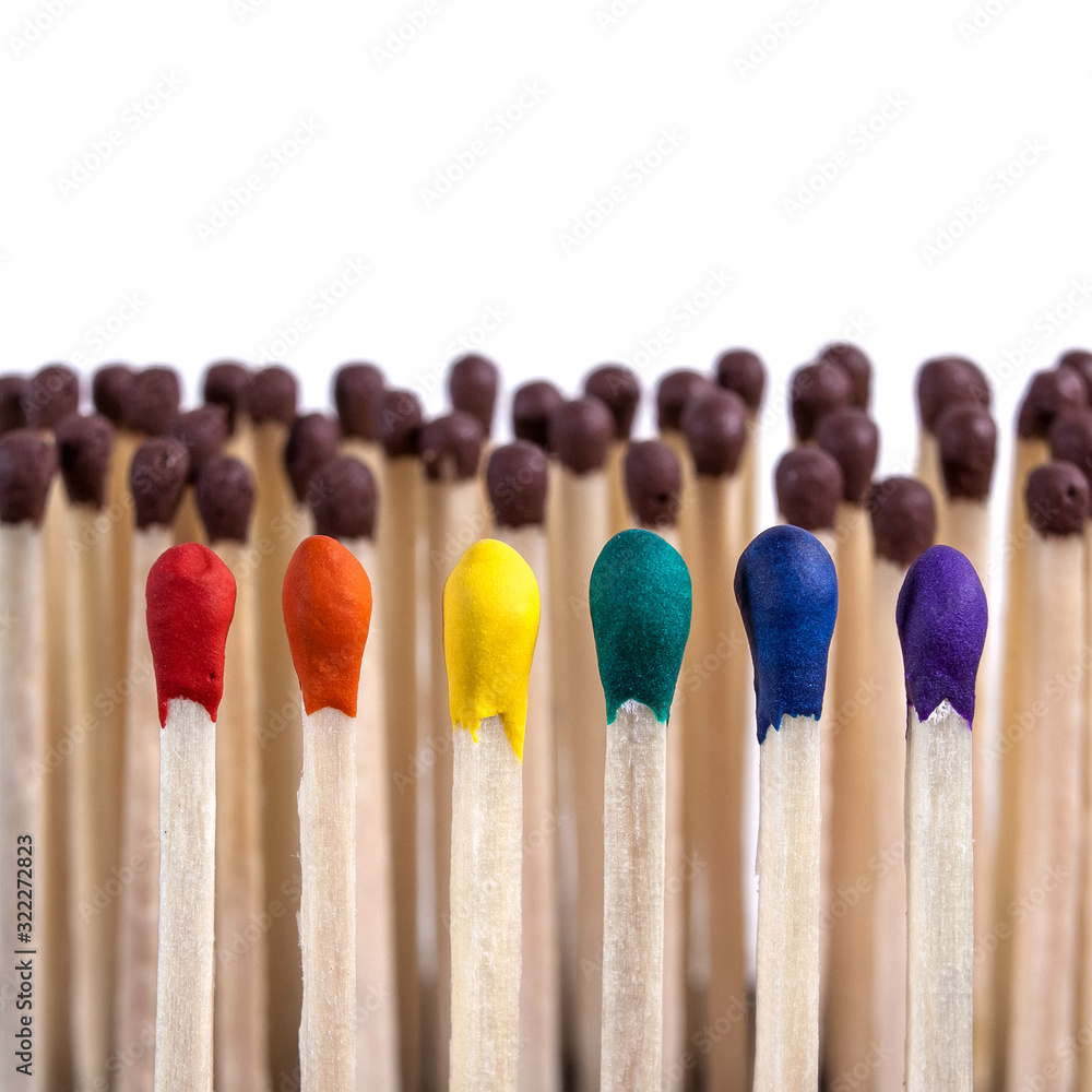 LGBT, protection of human rights concept. Multicolored matches in the colors of the flag of sexual minorities against the background of ordinary matches. LGBT equal rights movement and gender equality LGBT, protection of human rights concept. Multicolored matches in the colors of the flag of sexual minorities against the background of ordinary matches. LGBT equal rights movement and gender equality