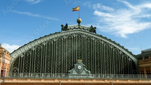 Spanish architecture. Exterior view of an old beautiful building of Madrid Atocha railway station. 4K