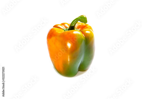 orange and green bell peper on white background