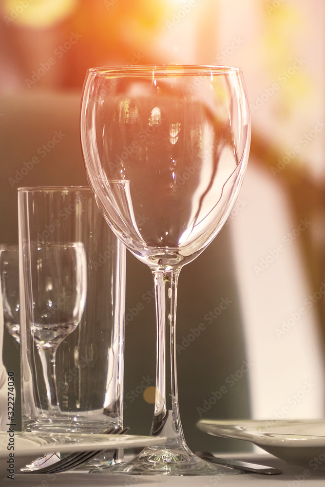 Empty wine glass on the table in a cafe or restaurant. Selective focus Empty wine glass on the table in a cafe or restaurant. Selective focus