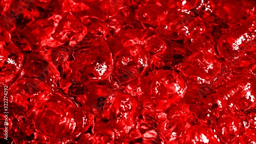 Boiling Scarlet Liquid. Intense drilling. Visual imitation of boiling blood. Slow motion boiling water, painted blood red