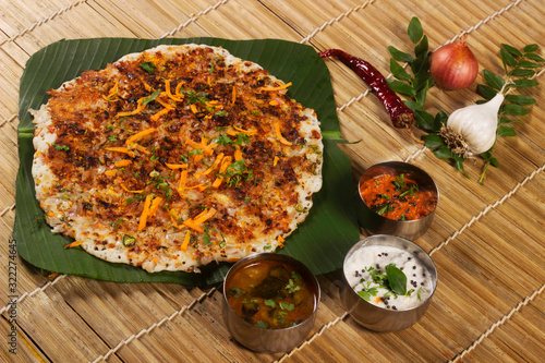Onion uthappam with sambar and coconut chutney. South Indian Vegetarian Snack