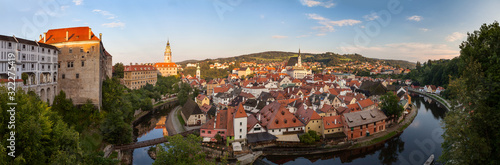 Panoramic view of beautiful city Cesky Krumlov with castle and church on river Vltava, Czech republic © honzahruby