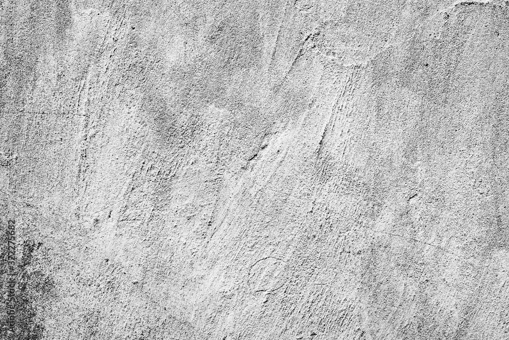 Naklejka premium Texture of a concrete wall with cracks and scratches which can be used as a background