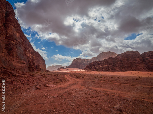 Beautiful Scenery Scenic Panoramic View Red Sand Desert and Ancient Sandstone Mountains Landscape in Wadi Rum, Jordan © thecriss