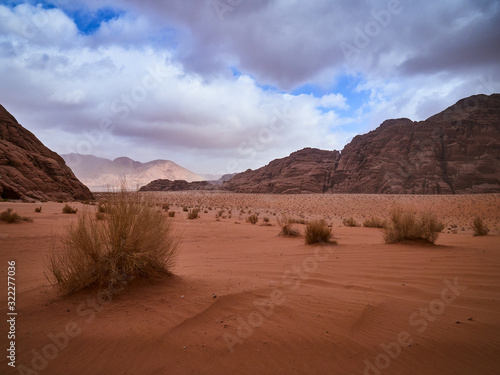 Fototapeta Naklejka Na Ścianę i Meble -  Beautiful Scenery Scenic Panoramic View Red Sand Desert and Ancient Sandstone Mountains Landscape in Wadi Rum, Jordan