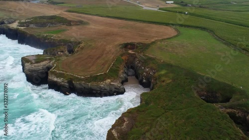 Aerial View of Coastline in Lugo , Beach, Cliffs and big waves. Drone Footage photo