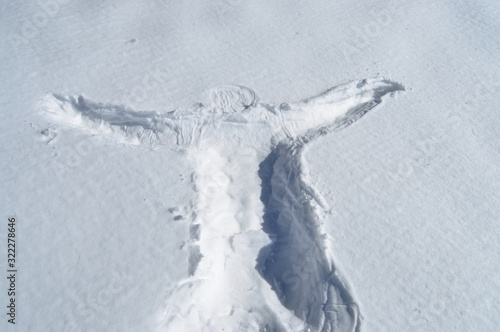 Human body print on fresh snow photo