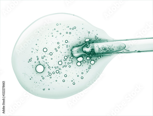 Photos Liquid gel or serum on a screen of microscope white isolated background