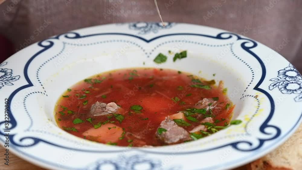 Woman eating red beef soup with beet vegetables Woman eating red beef soup with beet vegetables