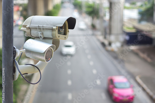 Closeup of traffic security camera surveillance (CCTV) on the road in the big city.