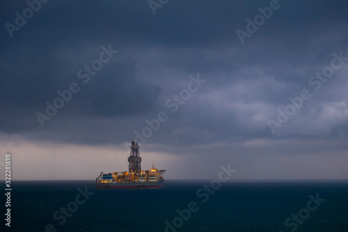 offshore oil drilling ship before the storm in the sea 