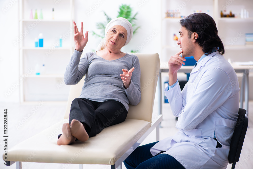 Young male doctor and female oncology patient Young male doctor and female oncology patient